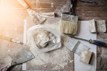 construction concept with old wood tools with wood workshop and light flare effect with color tome...