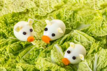 little pigs of quail eggs with lettuce