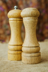 wooden pepper mill is on the table