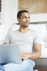 Home office is a good idea. Afro American businessman working online 