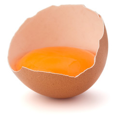 Broken egg  in eggshell half isolated on white background cutout