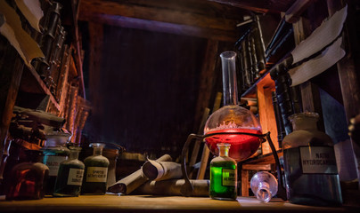 Medieval alchemist laboratory with various kind of flasks in Prague, czech republic