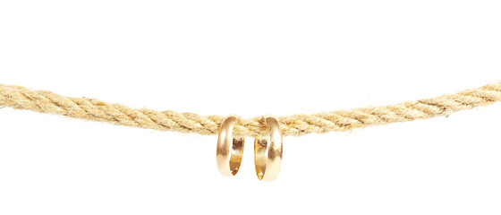 Two golden rings is hanging on the rope