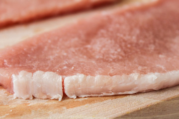 Meat  on wood, close up photo.