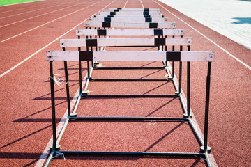 hurdle race on stadium track