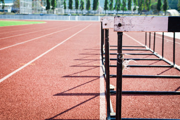 hurdle race on stadium track