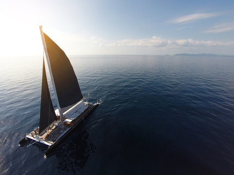 Fototapeta Amazing view to Yacht sailing in open sea at windy day. Drone view - birds eye angle. - Boost up color Processing.