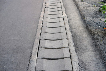 Cover of water drain on the road to collect raining water for sewage system