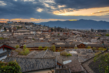 Lijiang Old Town bird eye top top view with local historical architectures roof building in sunrise...