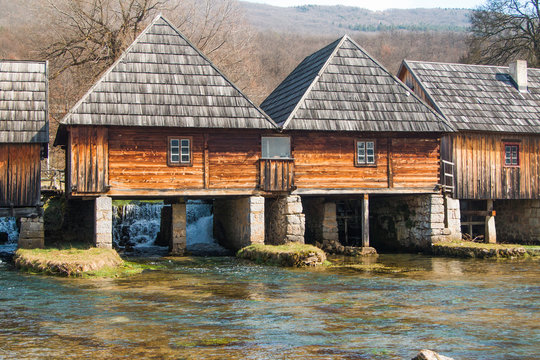      Old wooden water mills in on Majerovo vrilo, source of Gacka river, Lika, Croatia 