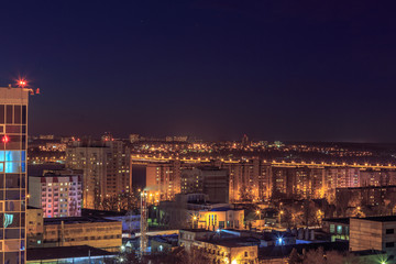 Fototapeta na wymiar Night aerial cityscape view to urban modern apartment buildings in Voronezh 