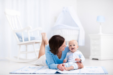 Mother and baby playing on the floor