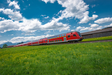 Rote Regionalbahn im Allgäu bei Oberstdorf - obrazy, fototapety, plakaty
