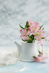 Spring flowers in a teapot