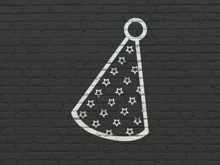 Entertainment, concept: Party Hat on wall background