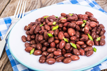 Spicy dish of red beans with green onions and spices