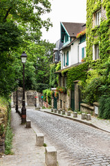 Charming old street of Montmartre hill. Paris, France