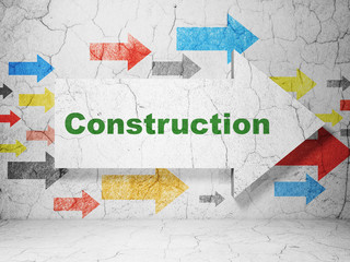 Building construction concept: arrow with Construction on grunge wall background