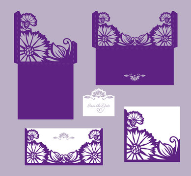 Set of laser cut wedding invitation card with cornflowers.