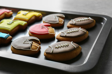 Obraz na płótnie Canvas Football cookies on baking tray, closeup