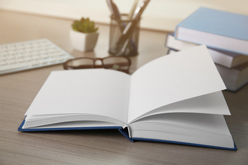 Open book on wooden table