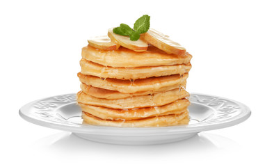 Plate with delicious pancakes on white background