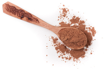 cocoa powder in a wooden spoon isolated on white background