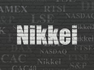 Stock market indexes concept: Nikkei on wall background
