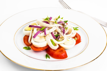 Seafood salad with squid on white background