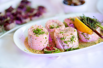 Delicious fish rolls with vegetables served on a party or wedding reception