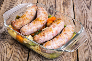 Country sausage with vegetables baked in the shape of glass