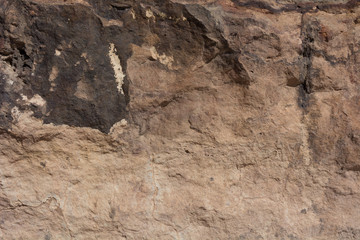 Textured surface of colorful rock