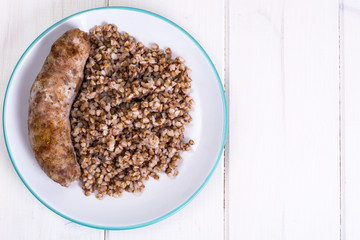 Fried sausage with buckwheat