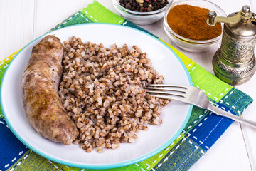 Fried sausage with buckwheat