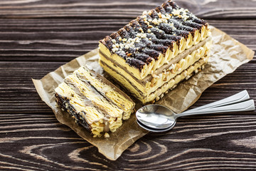Ice cream pistachio cake with chocolate on wooden background