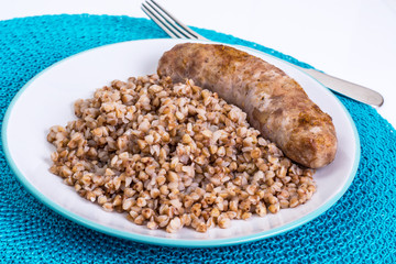 Fried sausage with buckwheat
