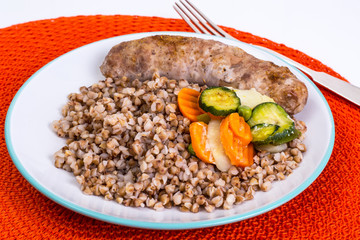 Fried sausage with buckwheat