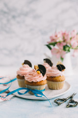 Vanilla cupcakes with cookies in spring style
