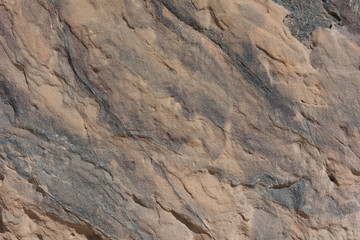 Textured surface of colorful rock