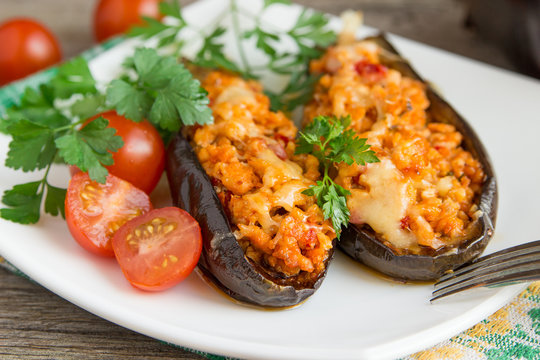 Baked stuffed eggplant with meat, vegetables and cheese.