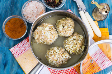 Meatballs with rice in broth