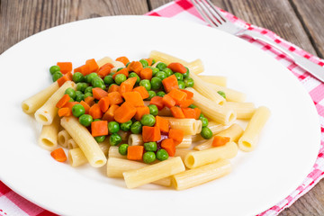 Rigatoni Pasta with vegetables in white plate