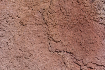 Textured surface of colorful rock