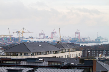 Fototapeta na wymiar DUBLIN - DECEMBER 12: View of foggy day at winter start over the port and industrial parts of in Dublin, Ireland, December 12th, 2016