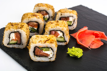 Original sushi rolls on black stone