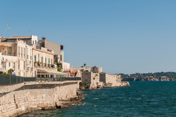 Fototapeta na wymiar Coast of Ortigia island at city of Syracuse, Sicily, Italy.