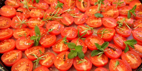 Cherry tomatoes with herbs and spices prepared for dried tomatoes