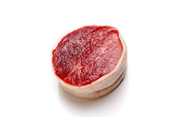 Fillet steak of beef with bacon (Tornado) on a white background. Not isolated.