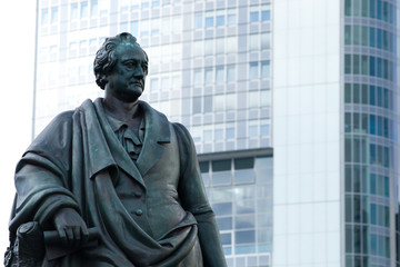 Goethe statue at Goetheplatz in Frankfurt with skyscraper