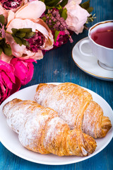 Croissant with kissel on blue background